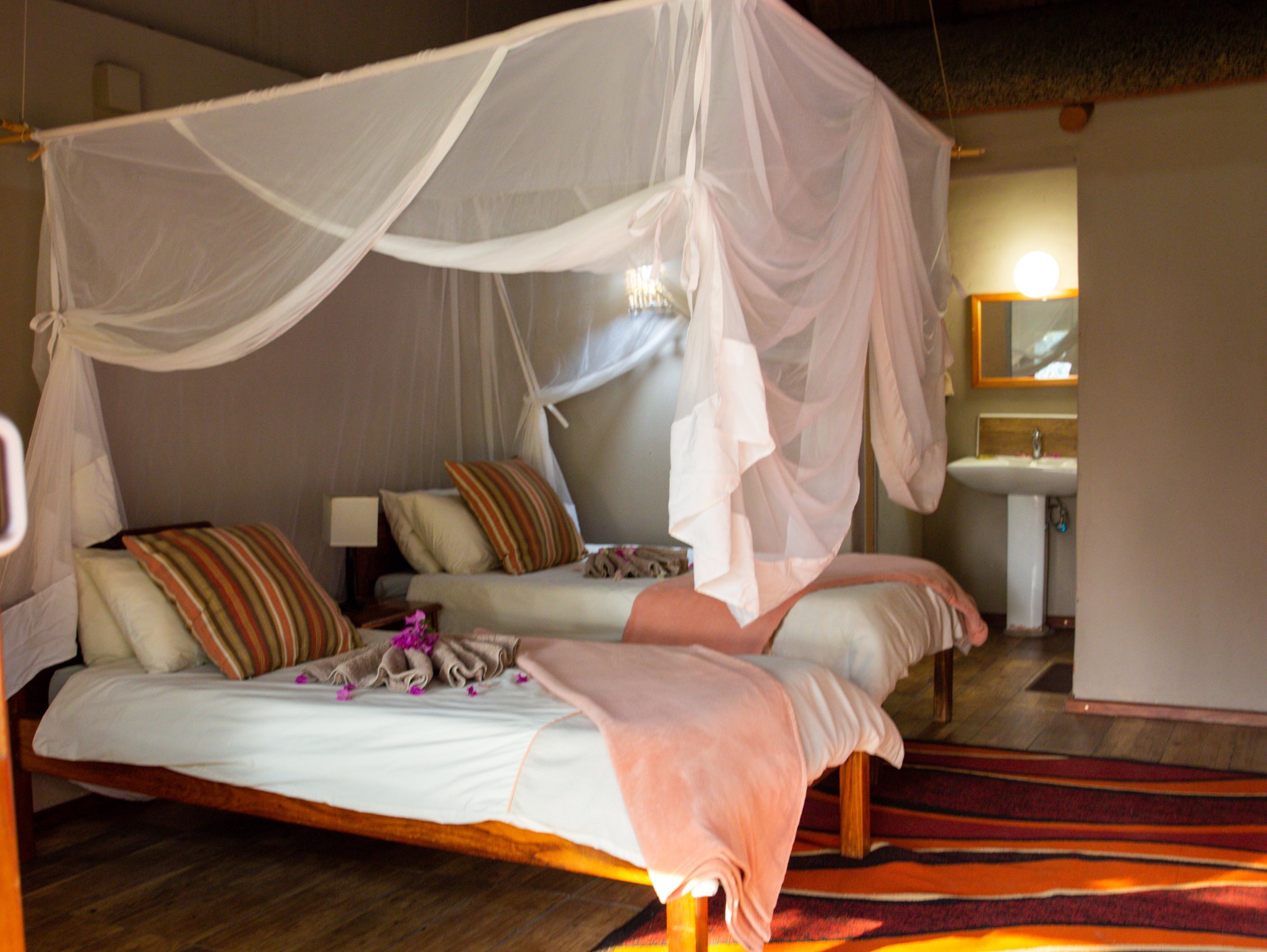 Double chalet bedroom with mosquito net and en-suite area