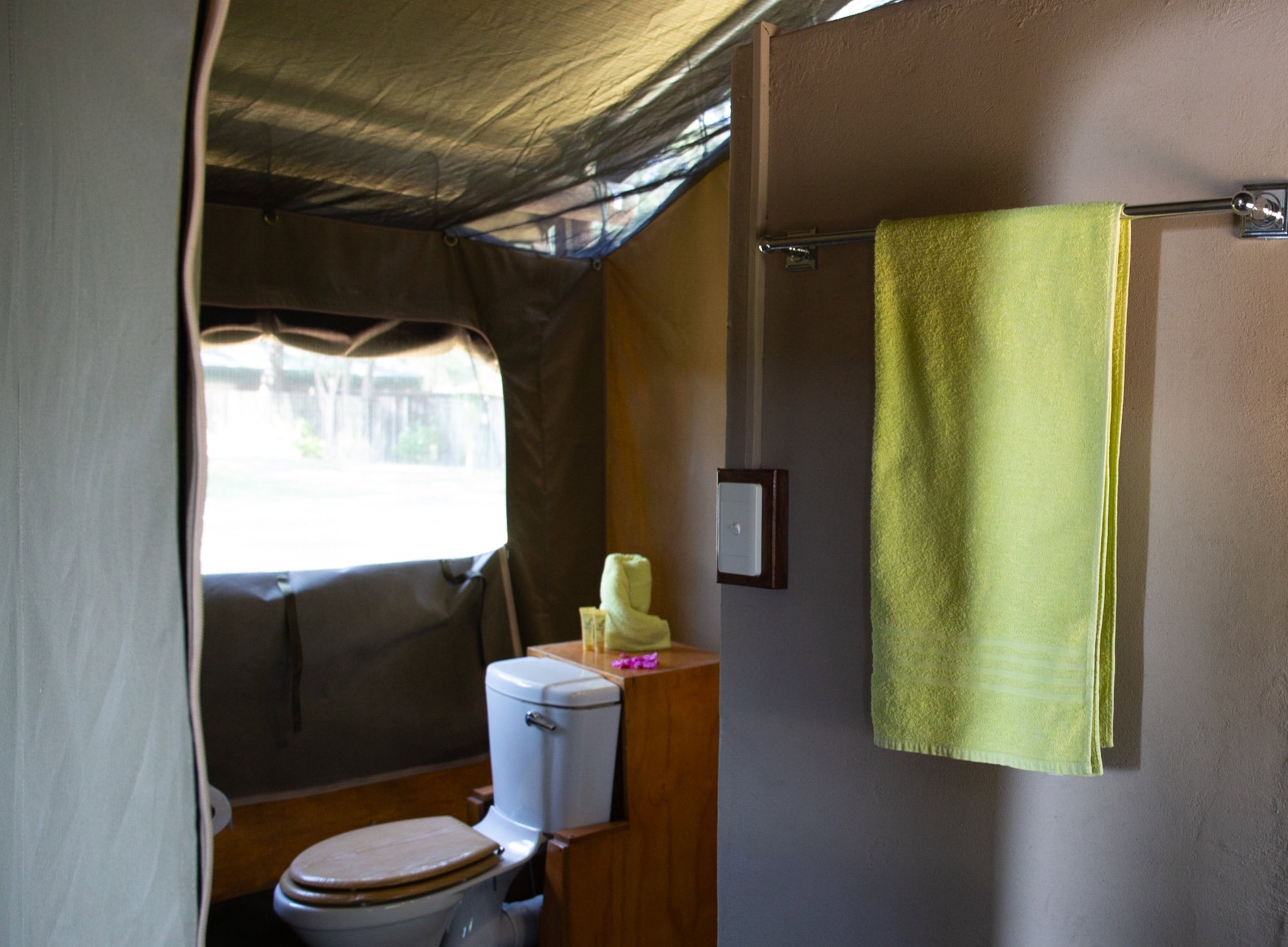 En-suite bathroom inside a safari tent